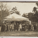 Cover image for Photographs -  Bound album titled 'Great Lake Hydro Electric Scheme' - photo of  The Steppes, Bothwell - home of the Wilson family  - standing outside the house with visitors