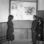 Cover image for Photograph - G.V. Brooks Community School, students with blackboard