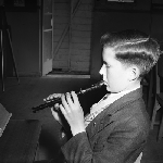 Cover image for Photograph - Class learning the recorder, hand position from left