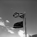Cover image for Photograph - G.V. Brooks Community School, flagpole with British and school flags