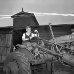 Cover image for Photograph - Scottsdale District Area School Farm, student with a tractor