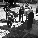 Cover image for Photograph - G.V. Brooks Community School, students laying concrete