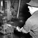 Cover image for Photograph - Factory worker making a Titan tool