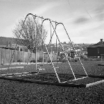 Cover image for Photograph - Playground equipment, swings