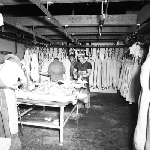 Cover image for Photograph - Bacon Factory and Freezing Works, Smithton, carcasses being dressed for export