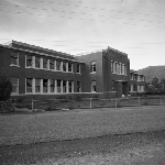 Cover image for Photograph - School building - "Area School Huonville" on front wall