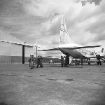 Cover image for Photograph - Cambridge Aerodrome, passengers alighting from Trans-Australian Airline (TAA) aircraft