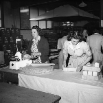 Cover image for Photograph - Haywoods Biscuit Factory, wrapping packets of Snax