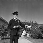 Cover image for Photograph - Hobart, Postman delivering mail
