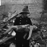 Cover image for Photograph - Hobart, Firemen with child rescued from fire