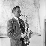 Cover image for Photograph - Man playing saxophone