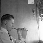 Cover image for Photograph - Boy playing pipe