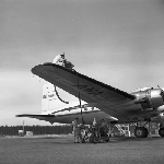 Cover image for Photograph - Llanherne (now Hobart) Airport, Australian National Airways (A.N.A.) DC 6 being serviced and refuelled