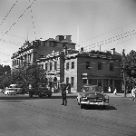Cover image for Photograph - Hobart, Police Officer on traffic duty on the corner of Macquarie and Murray Streets, with Government Tourist Bureau in the background