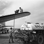 Cover image for Photograph - Llanherne (now Hobart) Airport, fuelling Australian National Airlines (A.N.A) plane