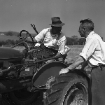 Cover image for Photograph - G.V. Brooks Community School, Visual Aids on location, L. Chappell talking to tractor driver