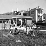 Cover image for Photograph - Campbell Street Pre-School, children playing outside school building