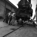 Cover image for Photograph - Hobart Wharf, unloading locomotives from "SS Belpareil"