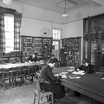 Cover image for Photograph - Hobart High School, students reading and studying in the library