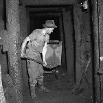 Cover image for Photograph - Oceana Silver Lead Mine, shovelling ore in tunnel