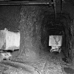 Cover image for Photograph - Oceana Silver Lead Mine, railway trolleys in tunnel at junction