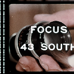 Cover image for Film - Focus 43 (degrees) South - An American photographer on location in Tasmania meets local girl who proves excellent guide & shows him around the local tourist places and spots to wine and dine. He returns to New York determined to return.