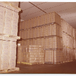 Cover image for Photograph - Lactos Pty Ltd - Factory interior - stacked pallets of cheese