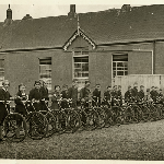 Cover image for Photograph - Students and bicycles outside Sheffield School