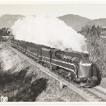 Cover image for Photograph - Tasmanian "Boat" train headed by an R-class No 3 / Ben Sheppard [Carried passengers booked on Bass Strait ferry]