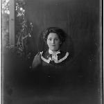 Cover image for Photograph - Head and shoulders of unidentified woman (dress with white ribbon collar)