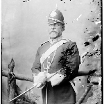 Cover image for Photograph - portrait of a man in uniform - pith helmet with a spear top - volunteer - police?