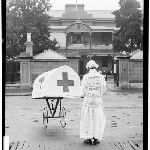 Cover image for Photograph - General Hospital Hobart, entrance [man dressed as a nurse to advertise movie 'Oh What a Nurse' at His Majesty's Theatre  Aug 1927] [glass plate]