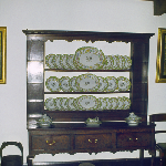 Cover image for Photograph - Hadspen - 'Entally House' - interior view of house - porcelain dinner service on sideboard shelves