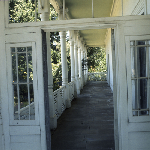Cover image for Photograph - Hagley - 'Quamby' - exterior views of house - view under verandah