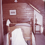 Cover image for Photograph - Longford - 'Racecourse Hotel' - interior view - Bedroom, Baltic pine ceiling, Colonial pine bed