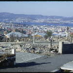 Cover image for 35mm colour transparency - 1967 Hobart Bushfires  -  Hobart - view of city and River Derwent from Forest Road - showing fire damage on Forest Road