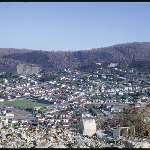 Cover image for 35mm colour transparency - 1967 Hobart Bushfires  -  South Hobart - view from top of Forest Road looking over South Hobart - panoramic view shows Huon Road across to Waterworks Road and Macquarie and Darcy Street intersection