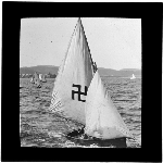 Cover image for Photograph - glass lantern slide - yacht 'Swastika' ? - with swastika insignia on sail