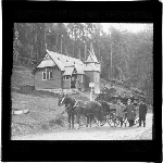 Cover image for Photograph - glass lantern slide - Fern Tree - Huon Road - St. Raphael's Anglican Church - carriage with two horses, passengers and three men standing - photo by E.R. Ash, Hobart