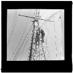 Cover image for Photograph - glass lantern slide - yachts - men on ladders in rigging of unidentified vessel - photo by Nat Oldham