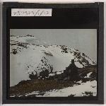 Cover image for Photograph - Climber (F. Smithies ?) on top of snow-covered mountain top (hand-coloured view) / Fred Smithies [lantern slide]