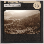 Cover image for Photograph - Sepia view of Smithies Tarn from mountain top (Cradle Mountain area?) / Fred Smithies [lantern slide]