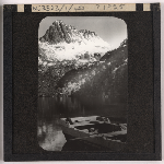 Cover image for Photograph - Cradle Mountain covered in snow from Dove lake - punt on the lake / Fred Smithies [lantern slide]