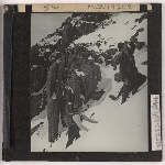 Cover image for Photograph - Gustav Weindorfer and Frederick Smithies climbing in the snow at Cradle Mountain / Fred Smithies [lantern slide]