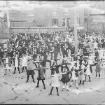 Cover image for Photograph - School Children - children doing physical education exercises in school yard of Central School, Bathurst Street