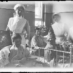 Cover image for Photograph - Glass negative - Hospital [three nurses with three patients in children's ward]