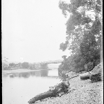 Cover image for Photograph - Glass negative - Near bridge [river scene with bridge in background]
