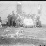 Cover image for Photograph - Glass negative - All Saints - group photo [group sitting outside church, dog in front Currie, King Isand]