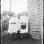 Cover image for Photograph - Glass negative - All Saints - dedication [clergy next to dedication stone] Currie, King Island