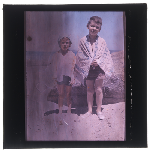 Cover image for Photograph - Glass slide - Two children in towels at beach (colour)